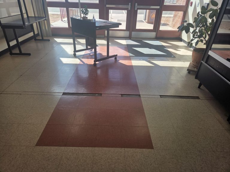 The floor in the Education building cracked and can see the concrete